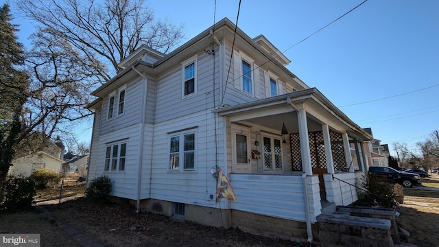 view of property exterior featuring covered porch