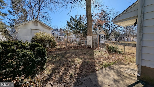 view of yard with a residential view and fence