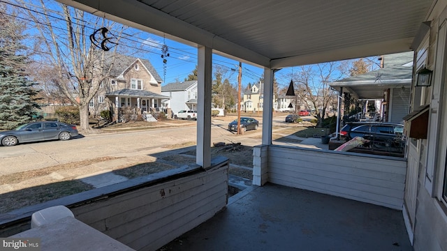 view of patio / terrace featuring covered porch and a residential view