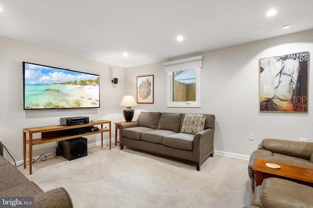 living area with light carpet, baseboards, and recessed lighting