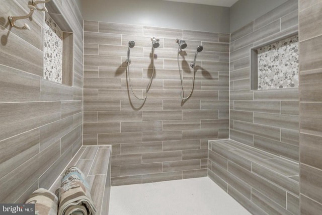 full bathroom with a tile shower