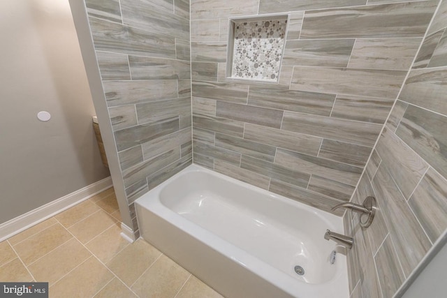 full bathroom featuring bathtub / shower combination, baseboards, and tile patterned floors