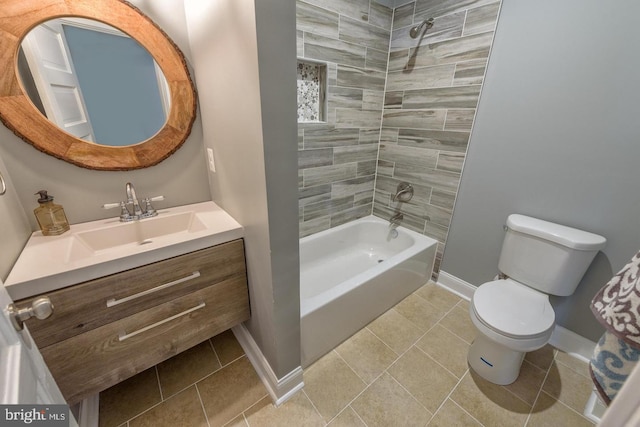 bathroom featuring baseboards, toilet, tile patterned flooring, tub / shower combination, and vanity