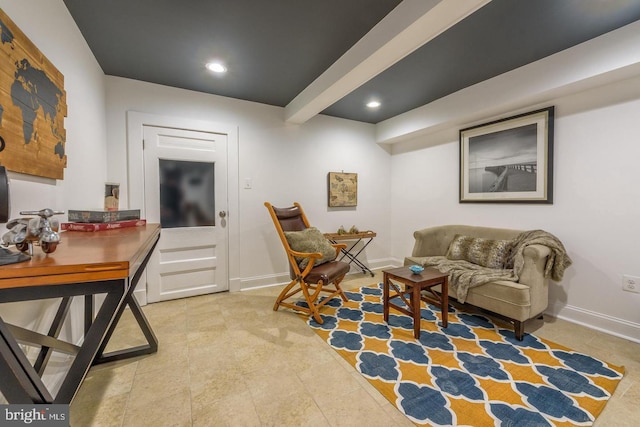 living area with baseboards and recessed lighting