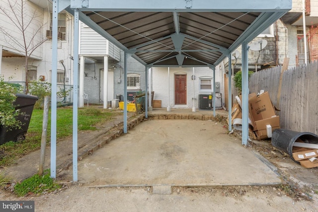 exterior space with fence and central AC unit