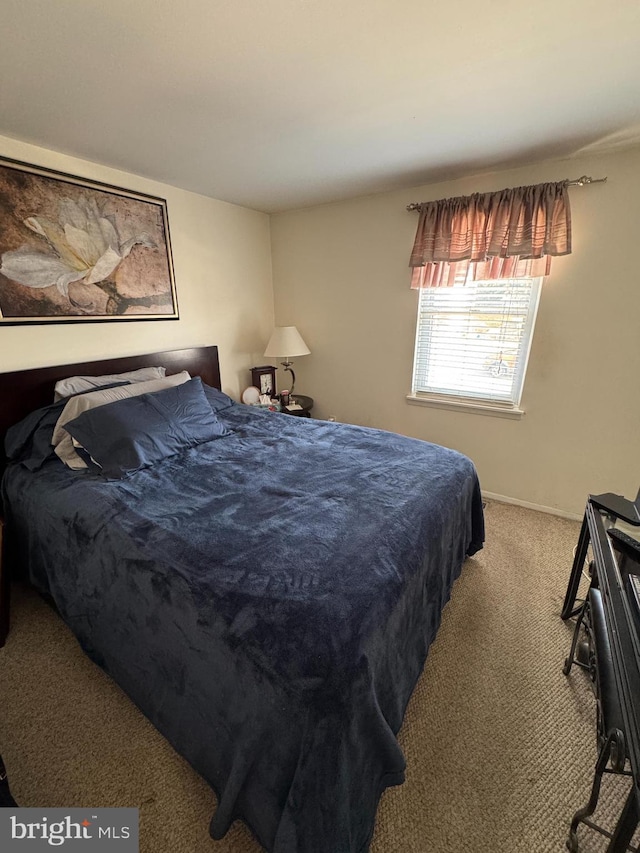 carpeted bedroom with baseboards