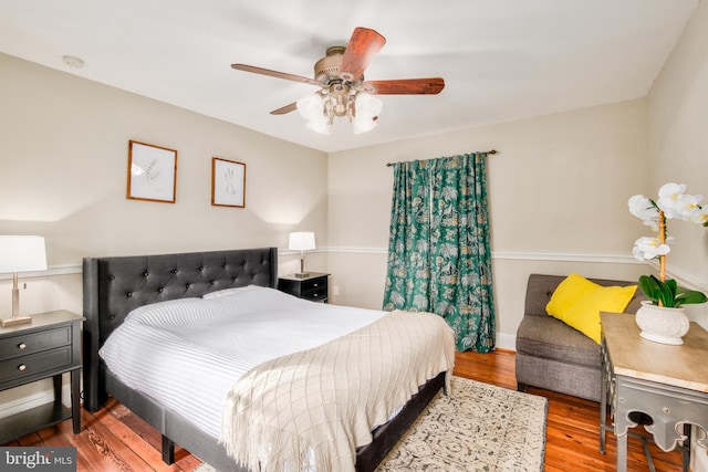 bedroom with a ceiling fan and wood finished floors