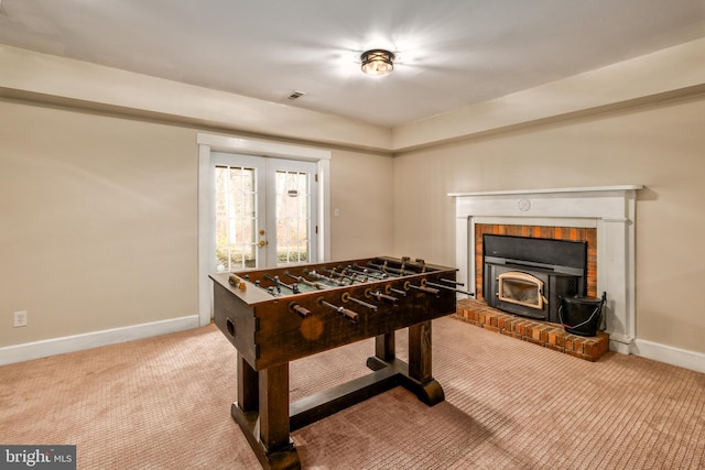 rec room featuring carpet, french doors, and baseboards