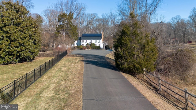 view of road featuring aphalt driveway