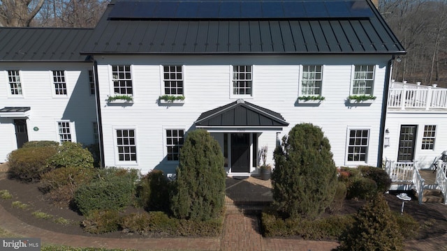 view of front of home featuring metal roof and a standing seam roof