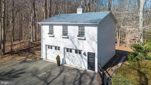 garage featuring driveway