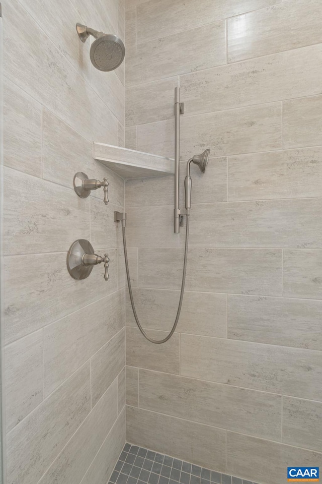 bathroom with tiled shower