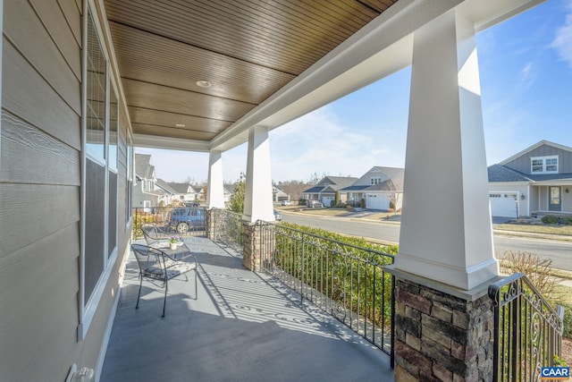 view of patio / terrace featuring a residential view and a porch