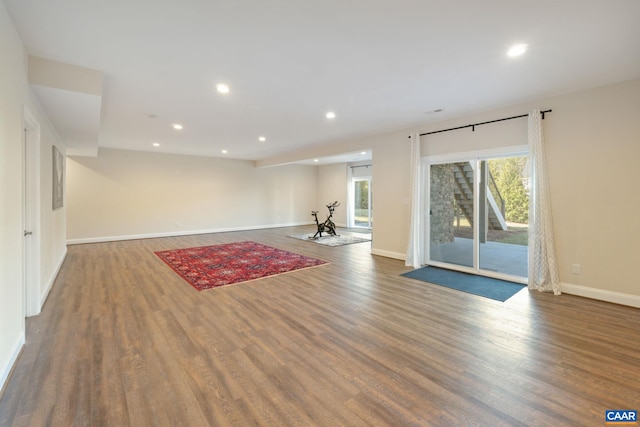 interior space with recessed lighting, baseboards, and wood finished floors