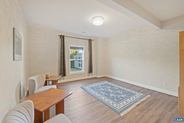 sitting room with wood finished floors and baseboards