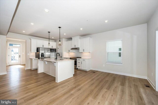 7508 Blue Sun Dr, Glen Burnie, MD 21060 - kitchen with stainless steel appliances, tasteful backsplash, a sink, and a healthy amount of sunlight