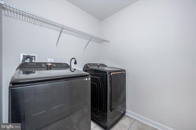 7508 Blue Sun Dr, Glen Burnie, MD 21060 - laundry area featuring washing machine and dryer, laundry area, light tile patterned flooring, and baseboards