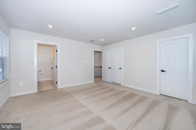 7508 Blue Sun Dr, Glen Burnie, MD 21060 - interior space featuring light carpet, recessed lighting, visible vents, and baseboards