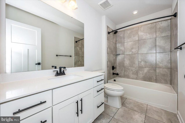 7508 Blue Sun Dr, Glen Burnie, MD 21060 - bathroom featuring toilet, bathing tub / shower combination, vanity, visible vents, and tile patterned floors