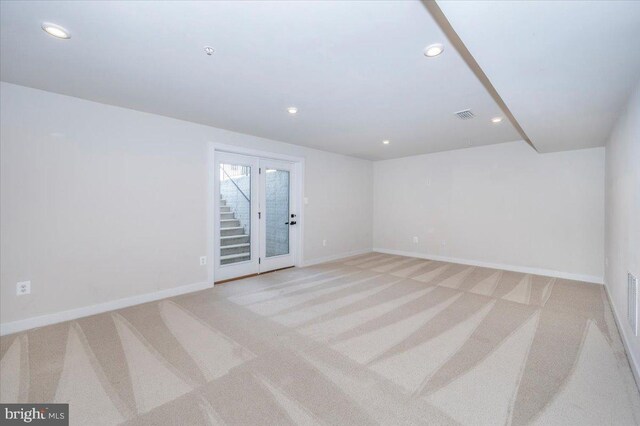 7508 Blue Sun Dr, Glen Burnie, MD 21060 - spare room with light colored carpet, visible vents, and baseboards