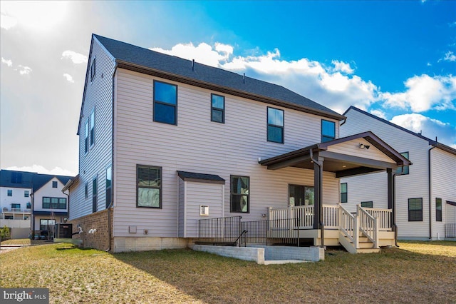 7508 Blue Sun Dr, Glen Burnie, MD 21060 - back of property featuring a yard and central AC unit