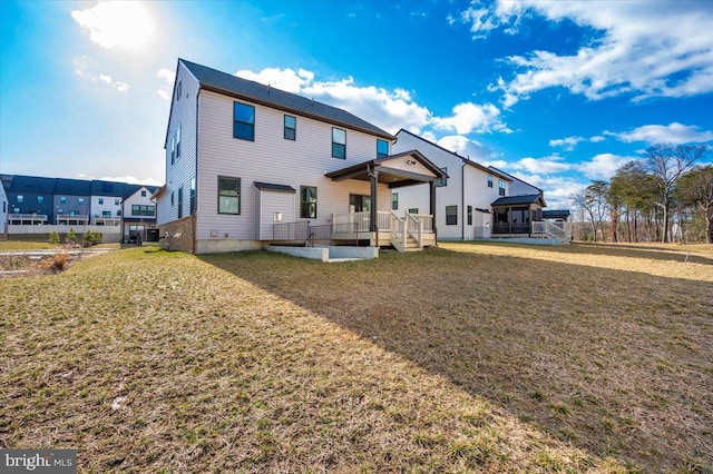 7508 Blue Sun Dr, Glen Burnie, MD 21060 - rear view of property featuring a yard