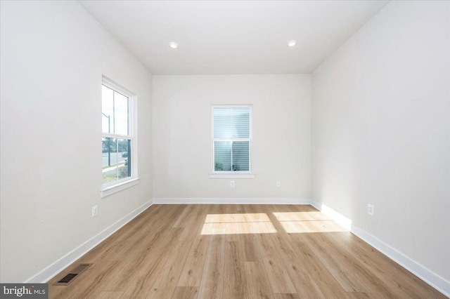 7508 Blue Sun Dr, Glen Burnie, MD 21060 - empty room featuring baseboards, visible vents, and wood finished floors