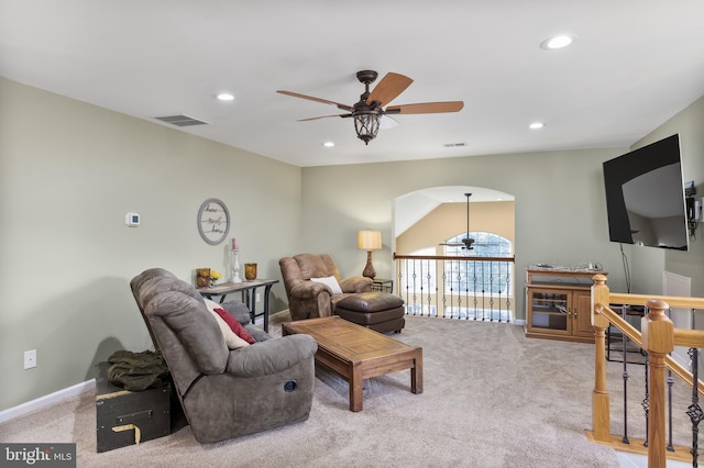 living area with light carpet, visible vents, a ceiling fan, and recessed lighting