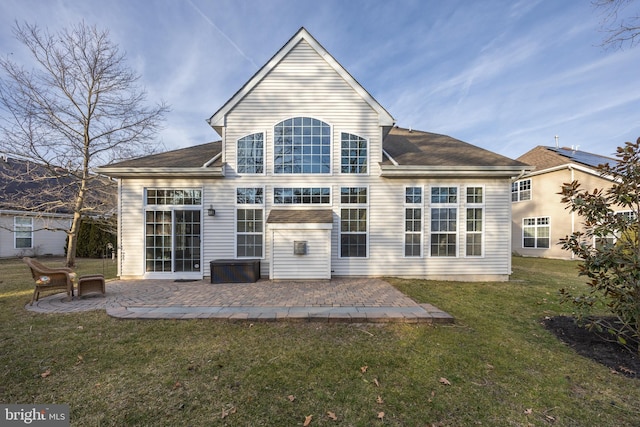 rear view of property with a patio area and a yard