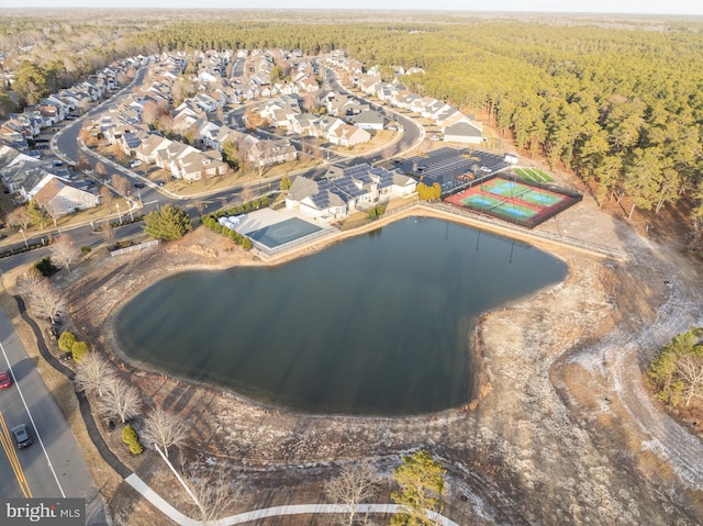 birds eye view of property with a water view, a forest view, and a residential view