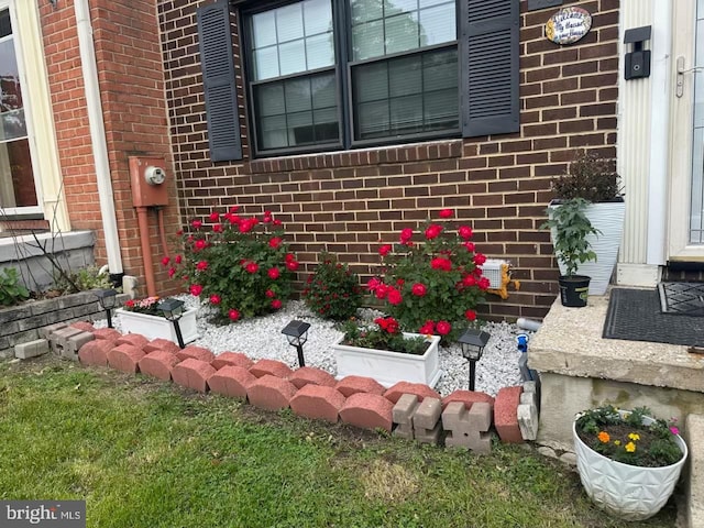 details with brick siding and electric meter