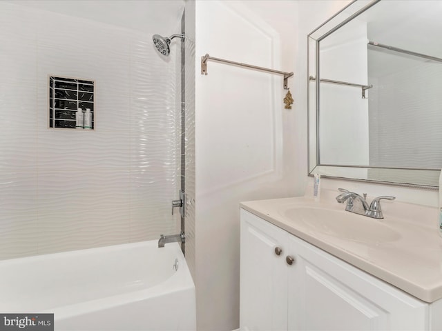 bathroom featuring tub / shower combination and vanity