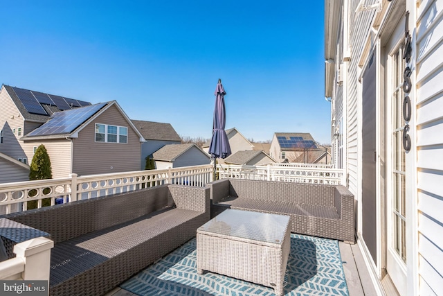 exterior space featuring a residential view and an outdoor living space