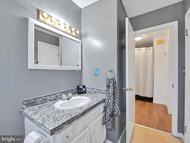 bathroom with vanity and tile patterned floors