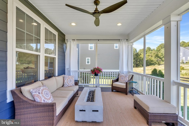 sunroom / solarium with ceiling fan