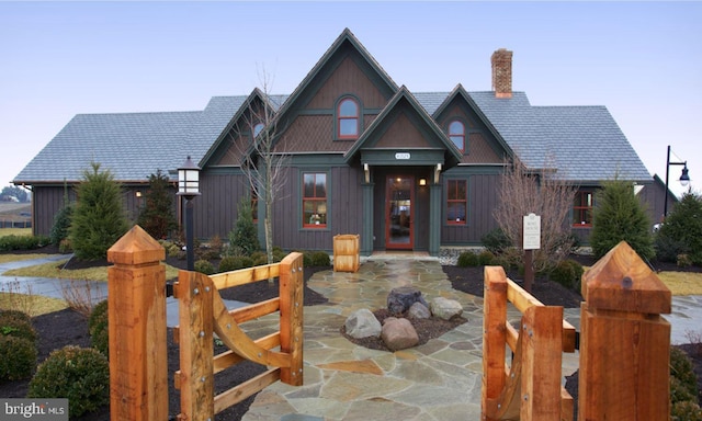 view of front of property featuring a chimney