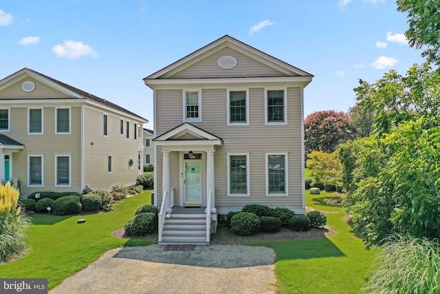 view of front of home with a front yard