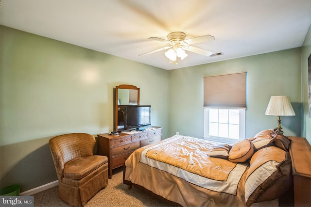 bedroom with visible vents, baseboards, a ceiling fan, and carpet flooring