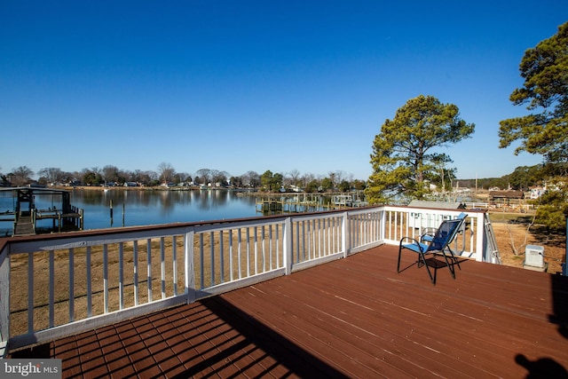 wooden deck with a water view