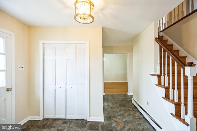 interior space featuring stairway, baseboards, and a baseboard heating unit