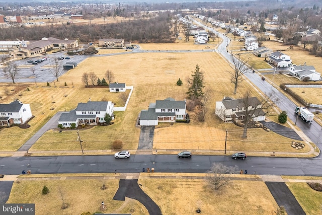 birds eye view of property with a residential view