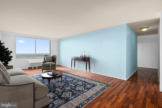 living room featuring wood finished floors and baseboards