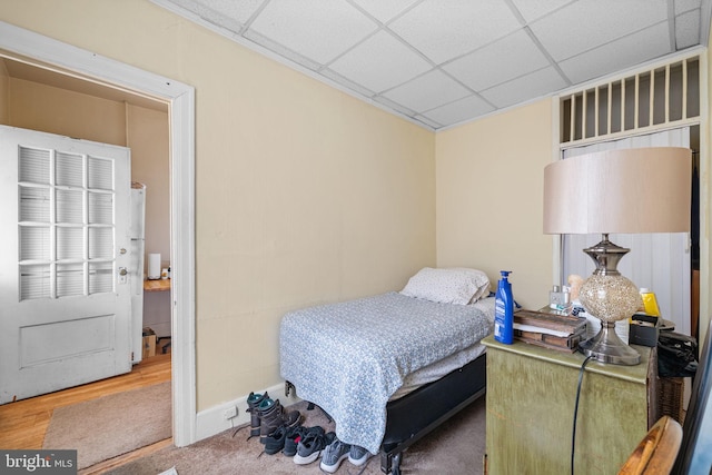 bedroom with a paneled ceiling