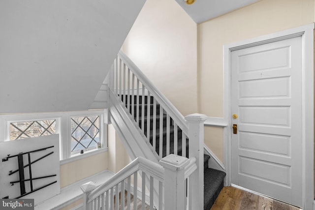 staircase with wood finished floors