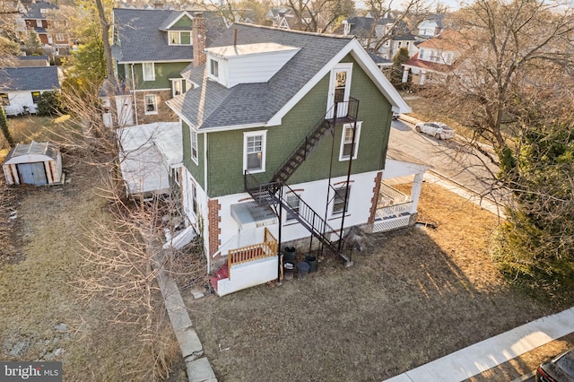 birds eye view of property with a residential view