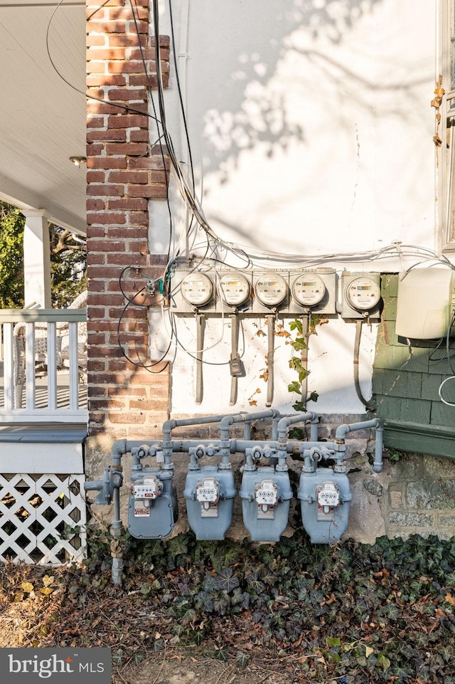 details featuring electric meter and gas meter