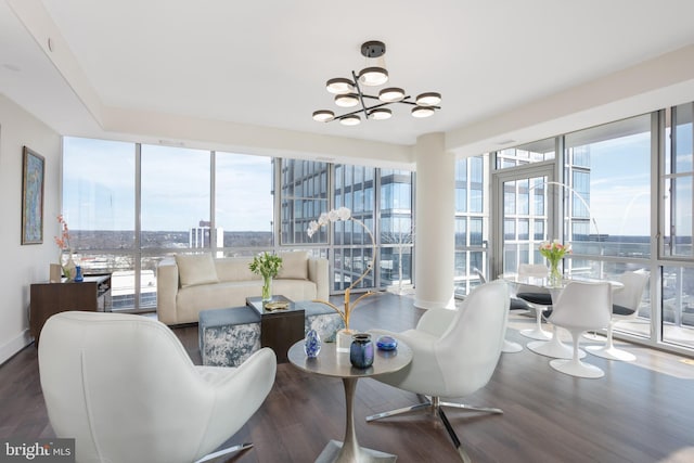 interior space featuring an inviting chandelier and a city view