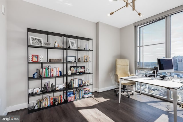 office space featuring baseboards and wood finished floors