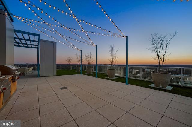 view of patio terrace at dusk