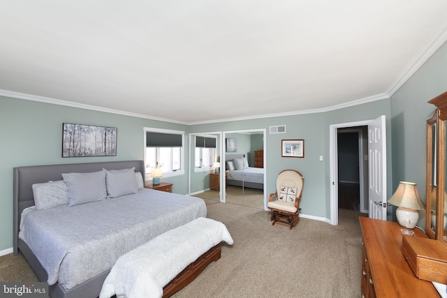 bedroom with ornamental molding, baseboards, visible vents, and carpet flooring